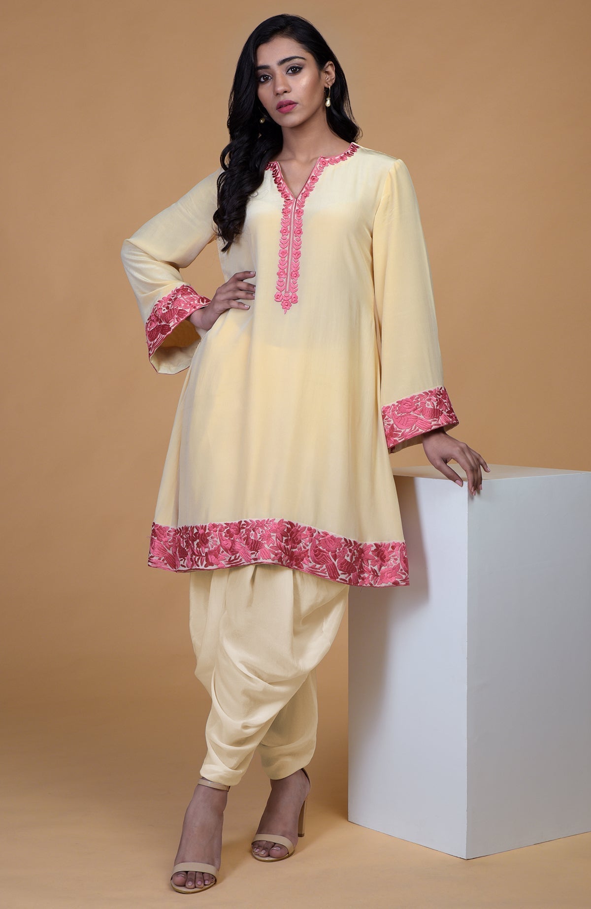 Beige short kurta with rose wine floral parsi gara embroidery and matching beige dhoti pants