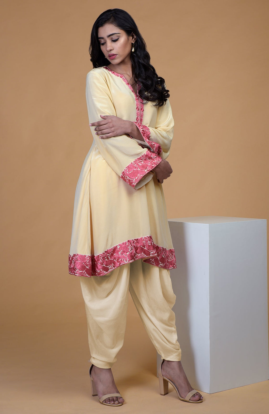 Beige short kurta with rose wine floral parsi gara embroidery and matching beige dhoti pants