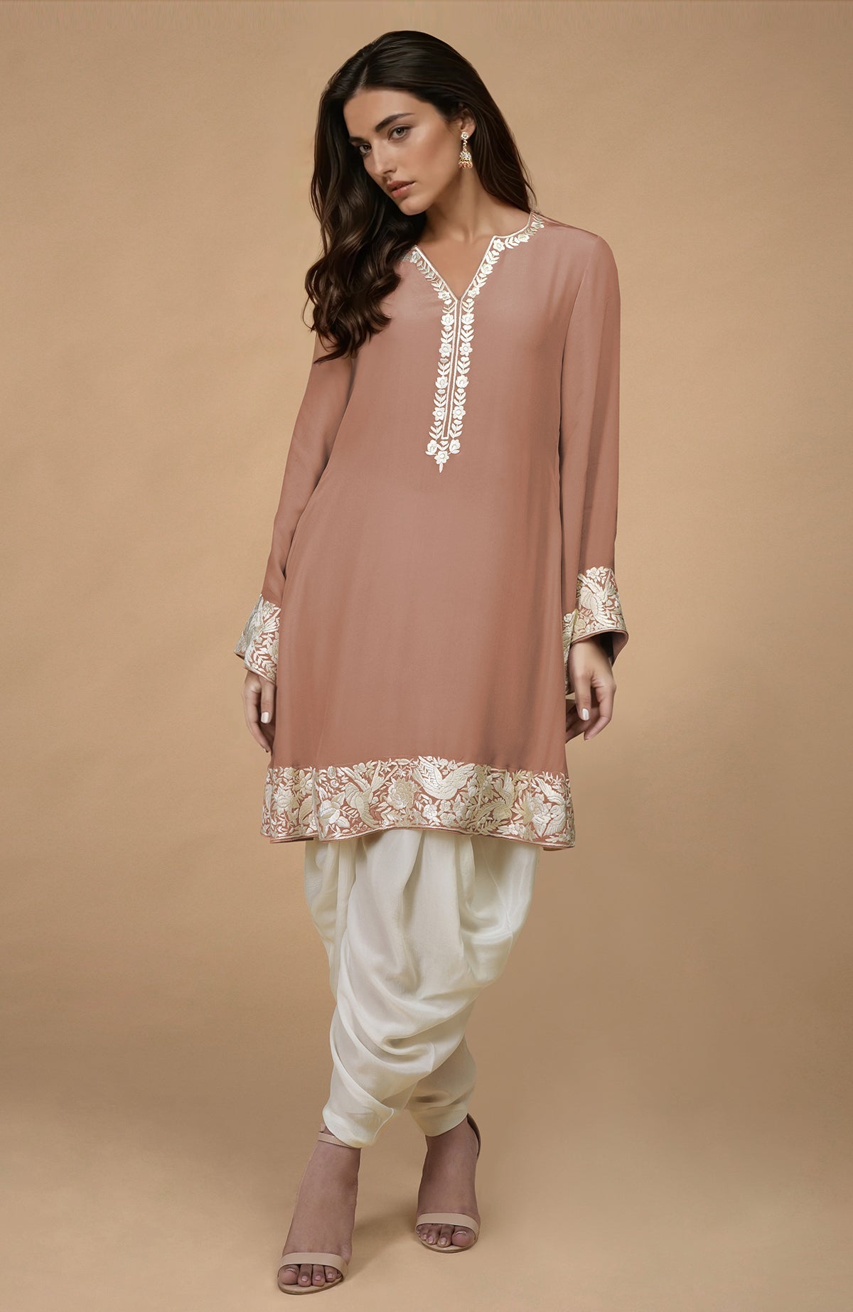 A model wears a sage green Parsi Gara embroidered Patiala pants suit.