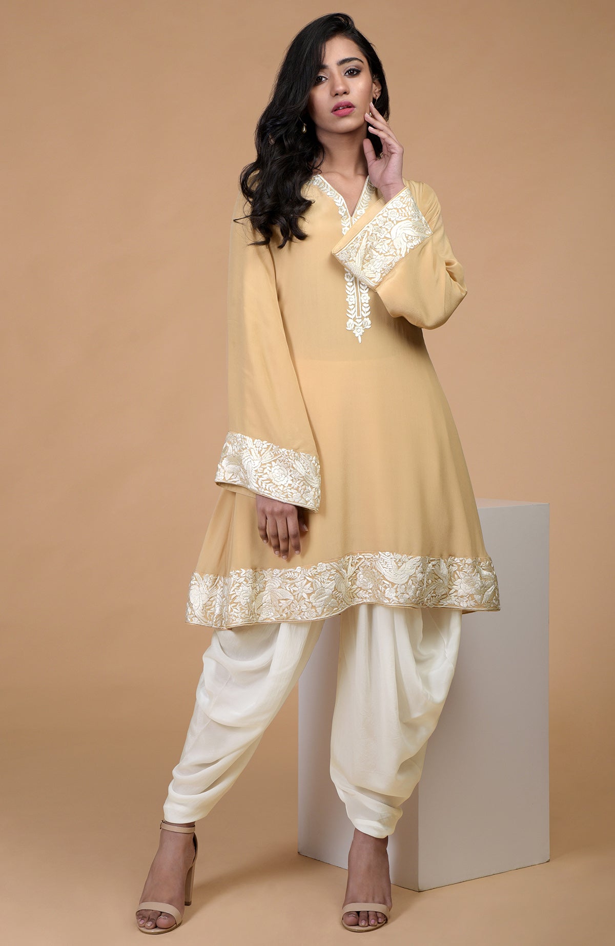 Mocha mousse kurta with ivory floral Parsi Gara embroidery and matching ivory dhoti pants.