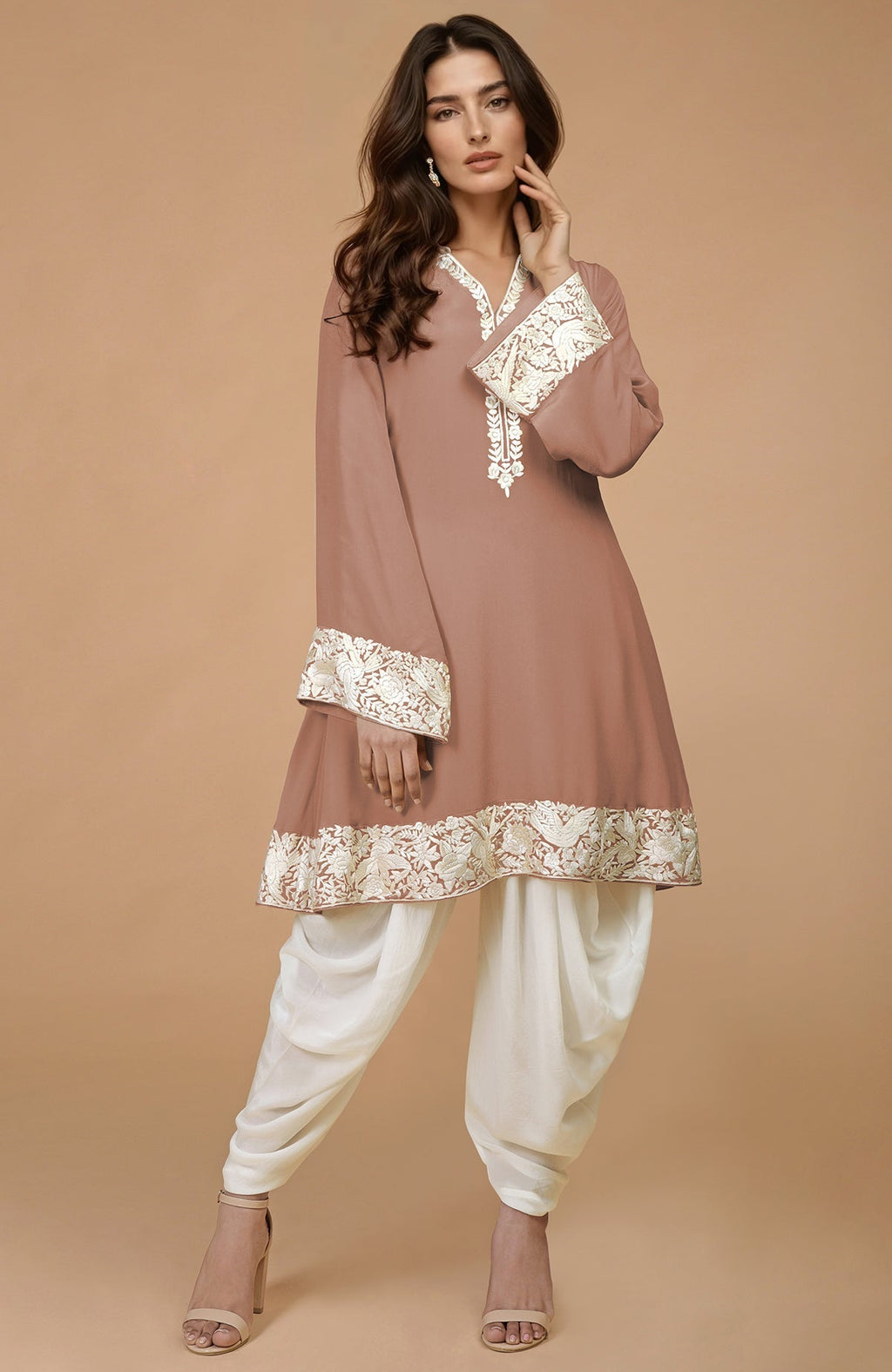 Mocha kurta with ivory Parsi Gara floral embroidery on hem, neckline, and sleeves, paired with ivory dhoti pants.