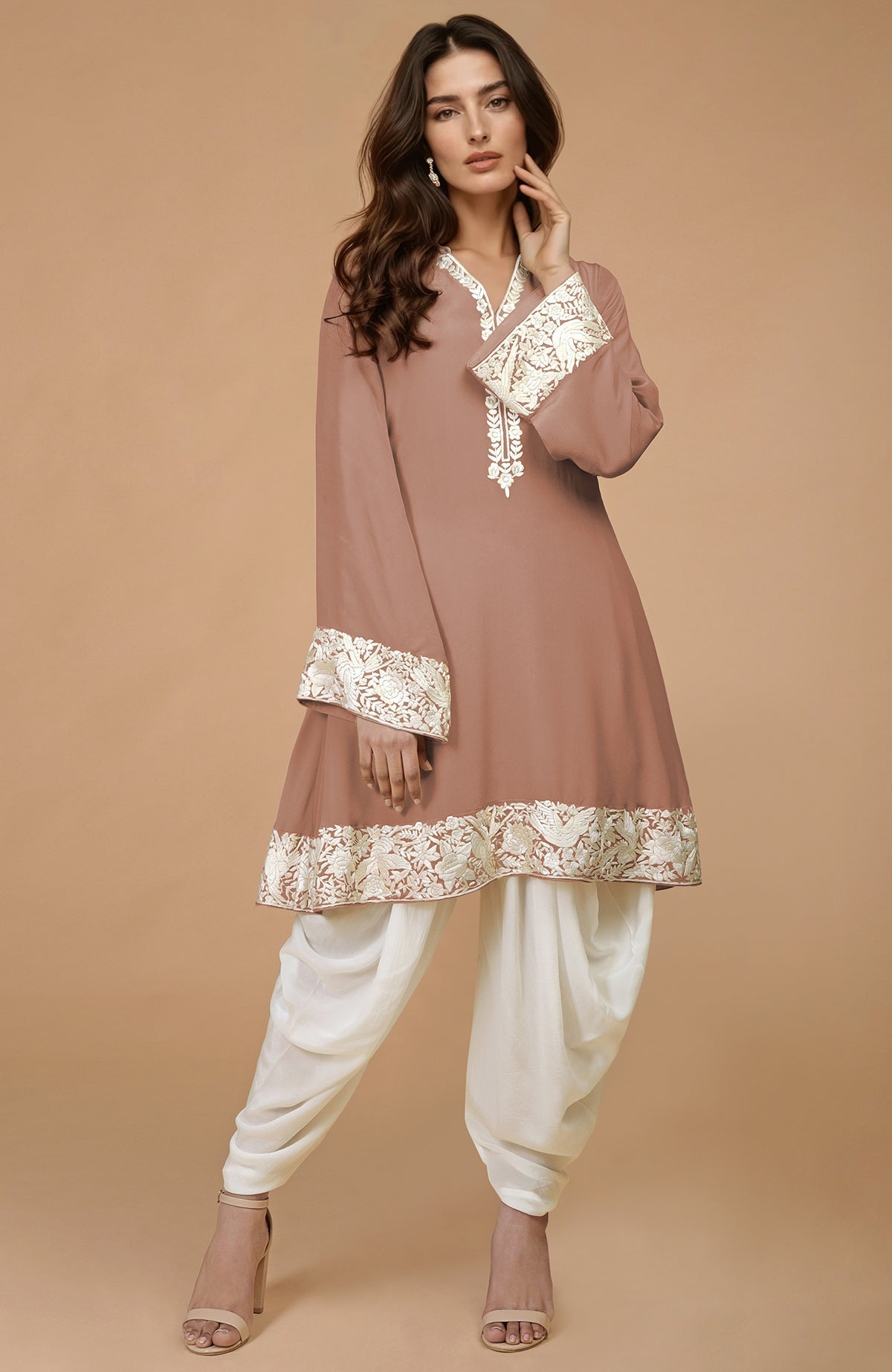 Mocha kurta with ivory Parsi Gara floral embroidery on hem, neckline, and sleeves, paired with ivory dhoti pants.