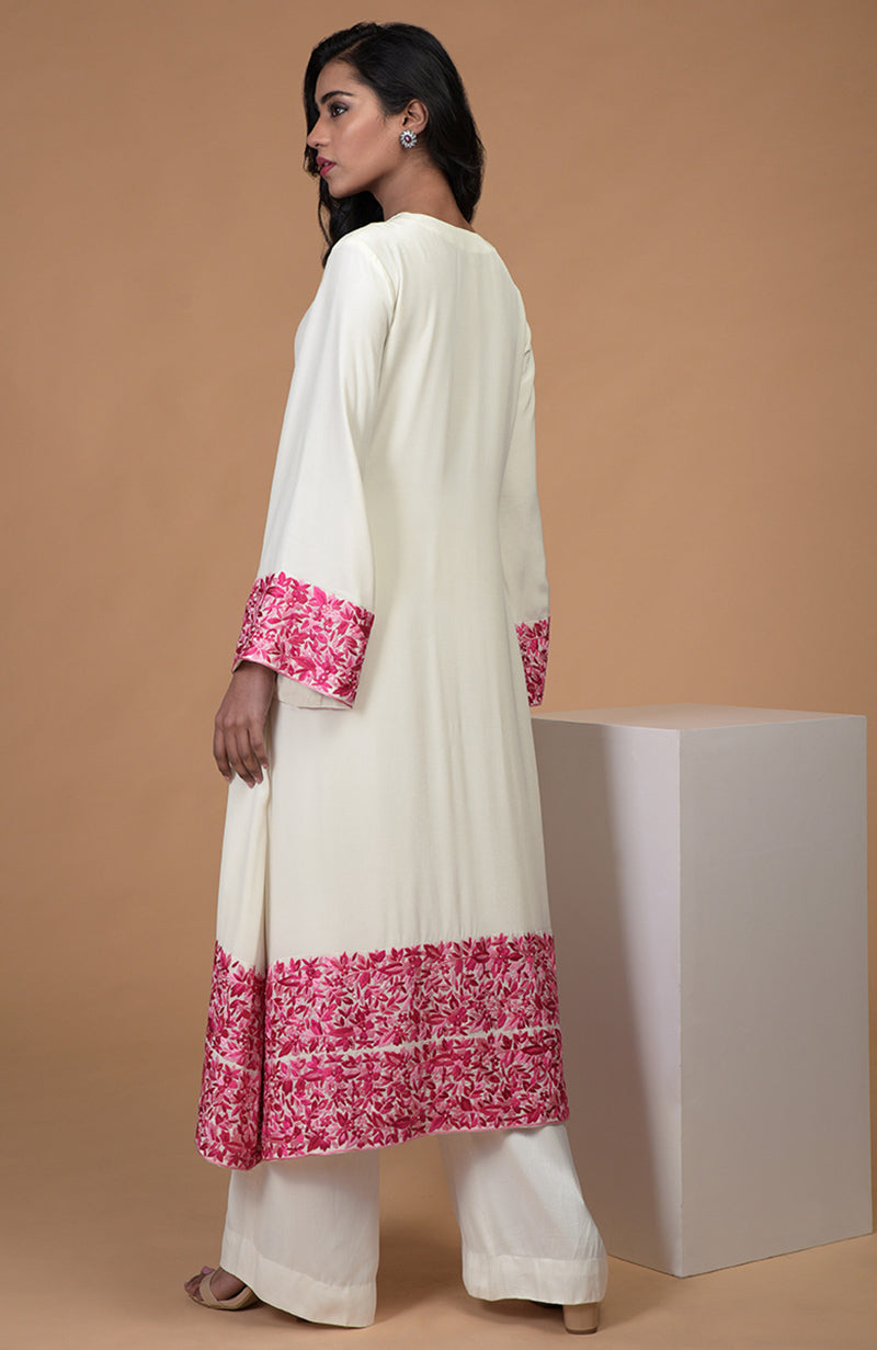 Ivory kurta with pink Parsi Gara embroidery, bell sleeves, jewel neckline, and matching wide leg pants