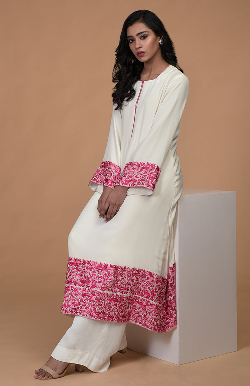 Ivory kurta with pink Parsi Gara embroidery, bell sleeves, and matching wide leg pants.