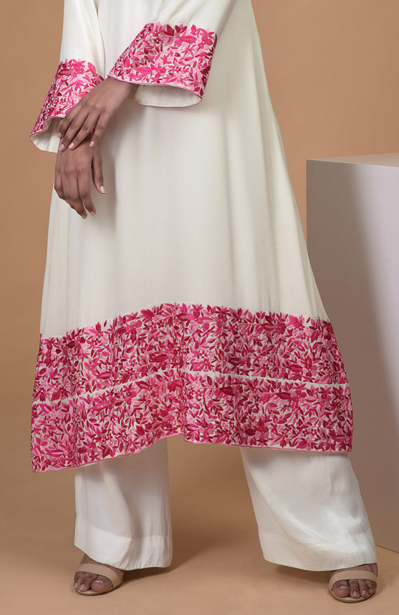 Ivory kurta with pink Parsi Gara embroidery, bell sleeves, jewel neckline, and matching wide leg pants