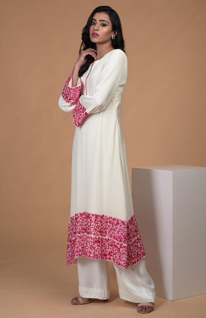 Ivory kurta with pink Parsi Gara embroidery, bell sleeves, and matching wide leg pants.