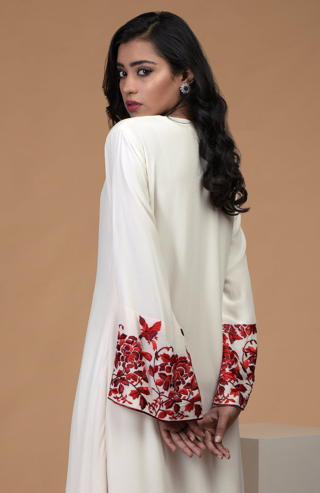 Ivory crepe kurta with red Parsi Gara floral embroidery and bell sleeves paired with ivory pants
