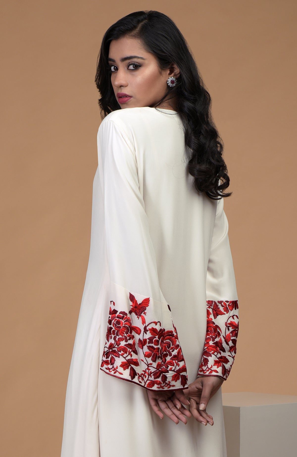 Ivory crepe kurta with red Parsi Gara floral embroidery and bell sleeves paired with ivory pants