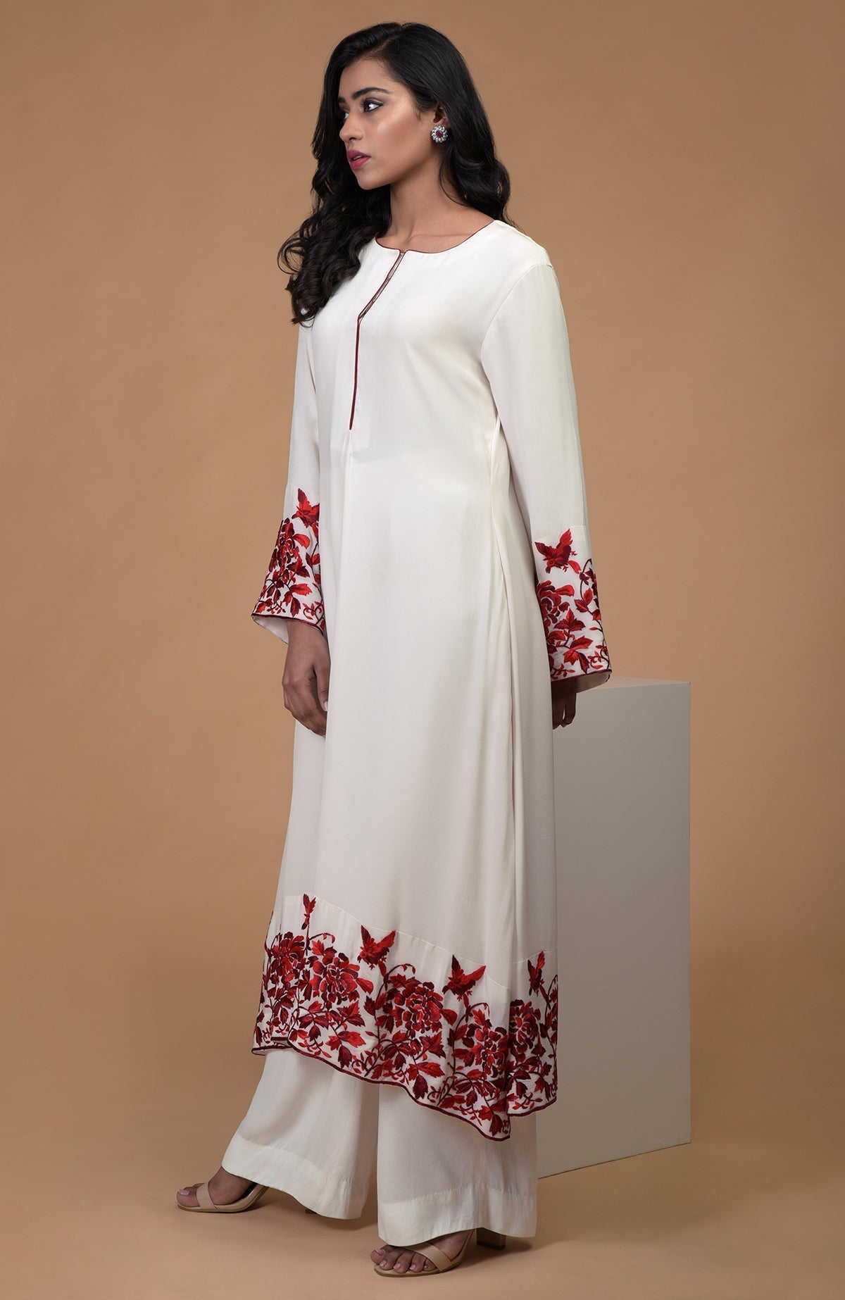 Ivory crepe kurta with red and maroon Parsi Gara embroidery and bell sleeves paired with ivory pants