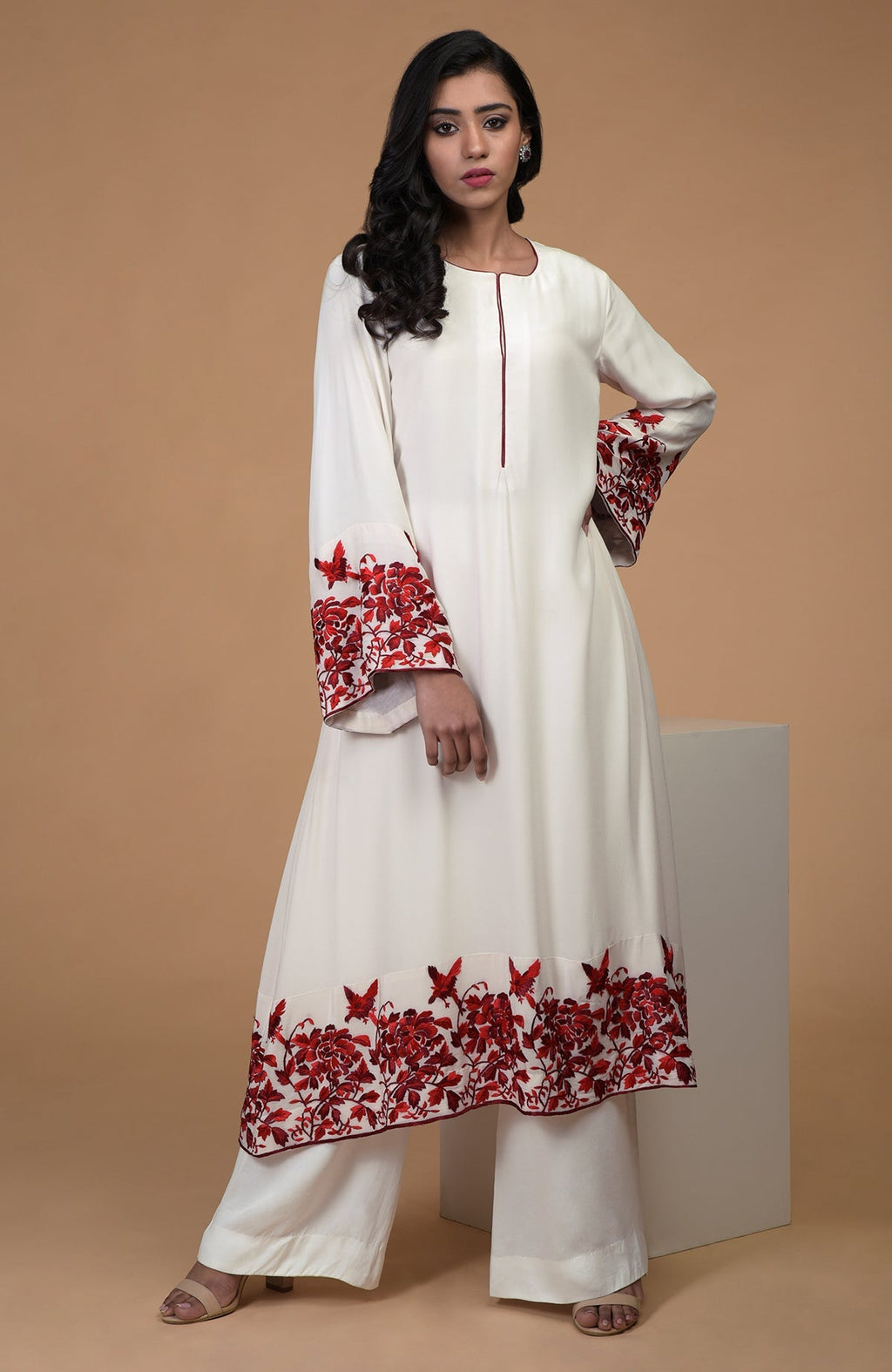Ivory crepe kurta with red Parsi Gara floral embroidery and bell sleeves paired with wide leg pants