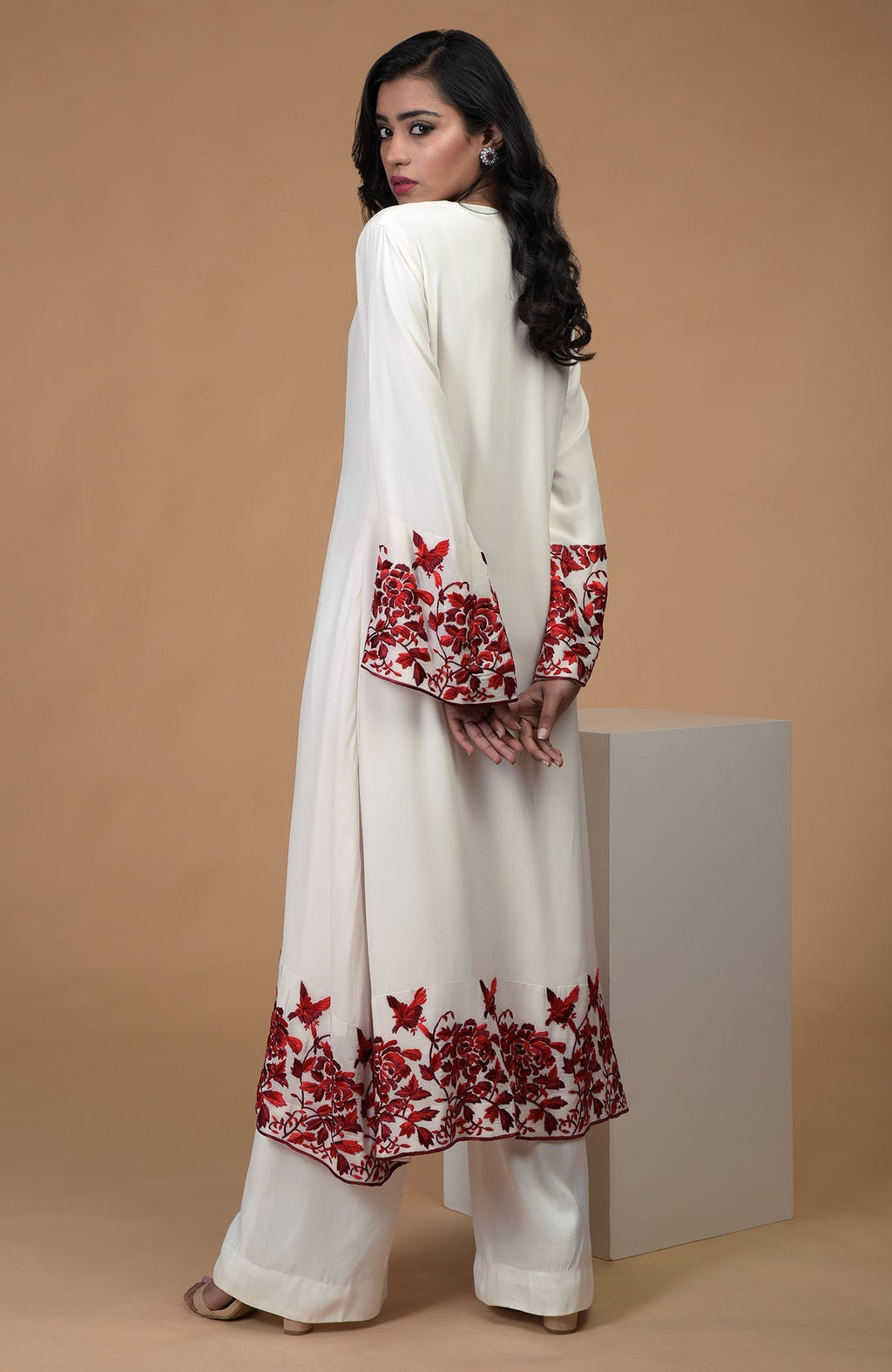 Ivory crepe kurta with red and maroon Parsi Gara floral embroidery and bell sleeves paired with wide leg pants