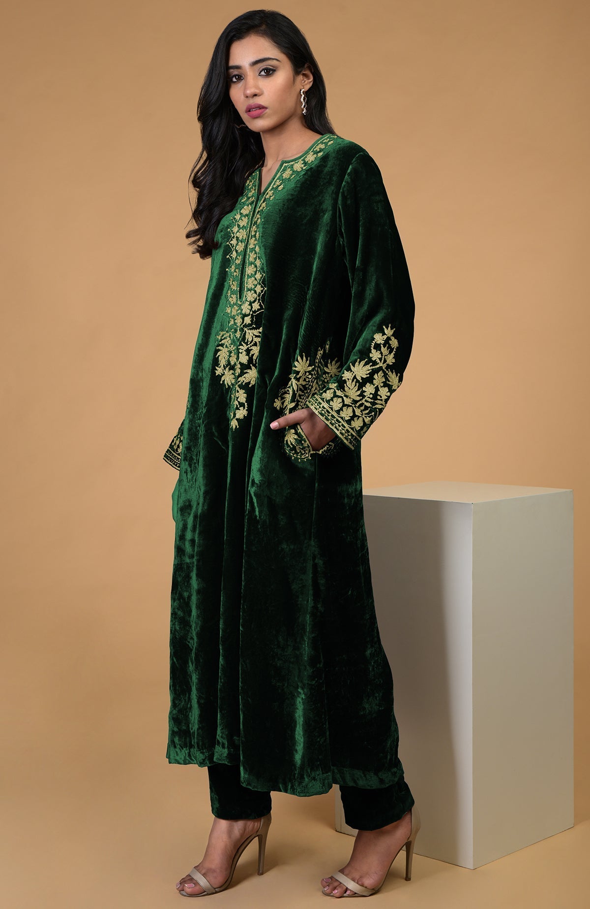 Emerald green silk velvet kurta with gold Kashmiri tilla aari embroidery and matching pants