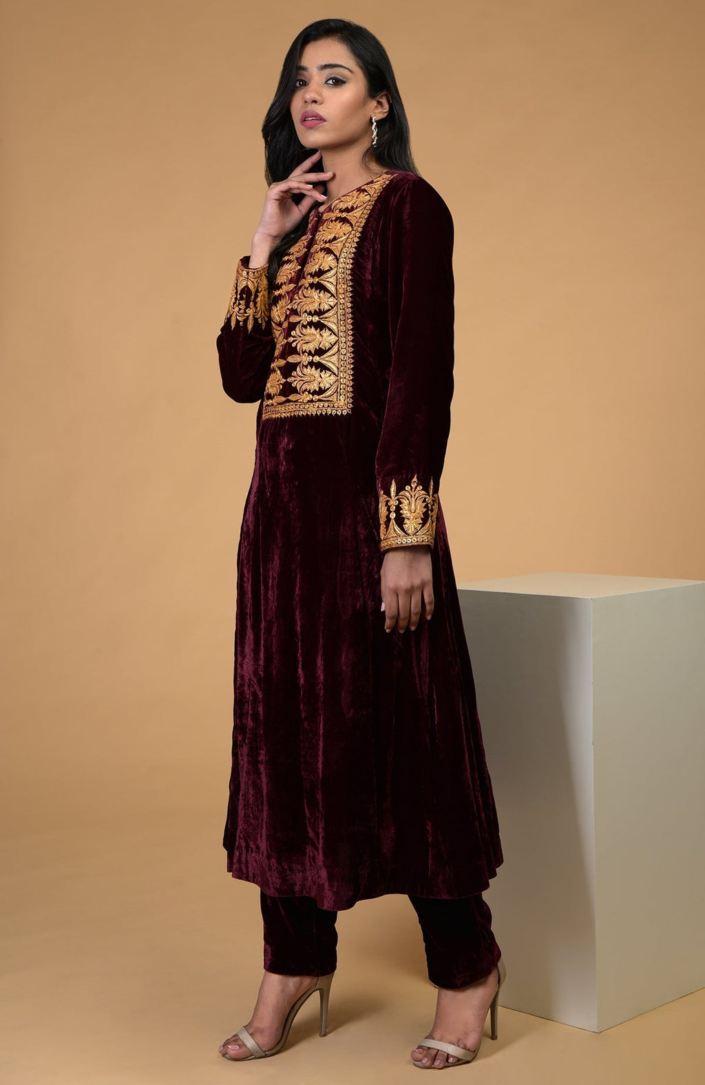 Rose maroon gold Kashmiri tilla embroidered kurta set on a model.