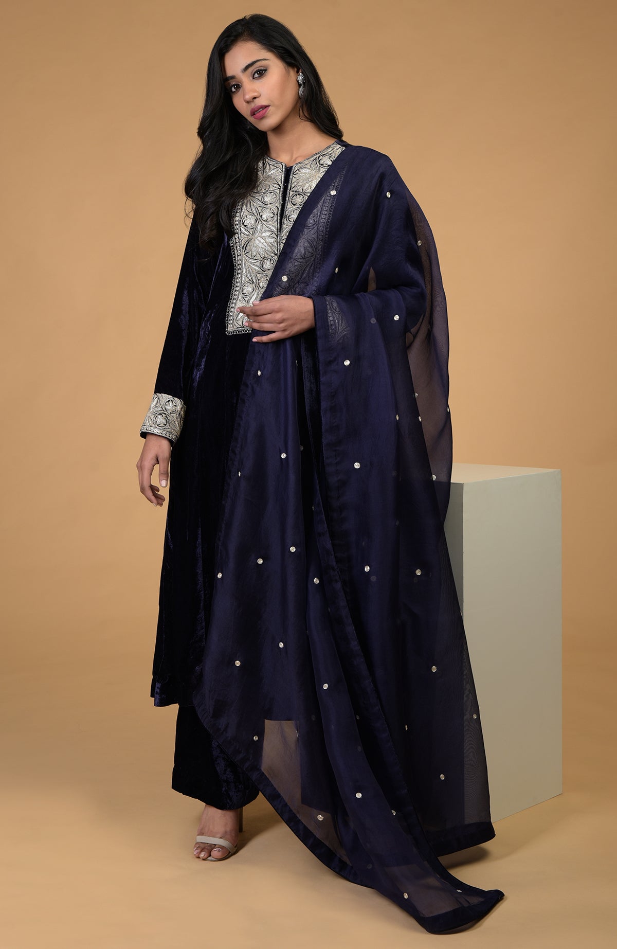 Midnight blue velvet kurta set with silver Kashmiri tilla embroidery and organza dupatta.