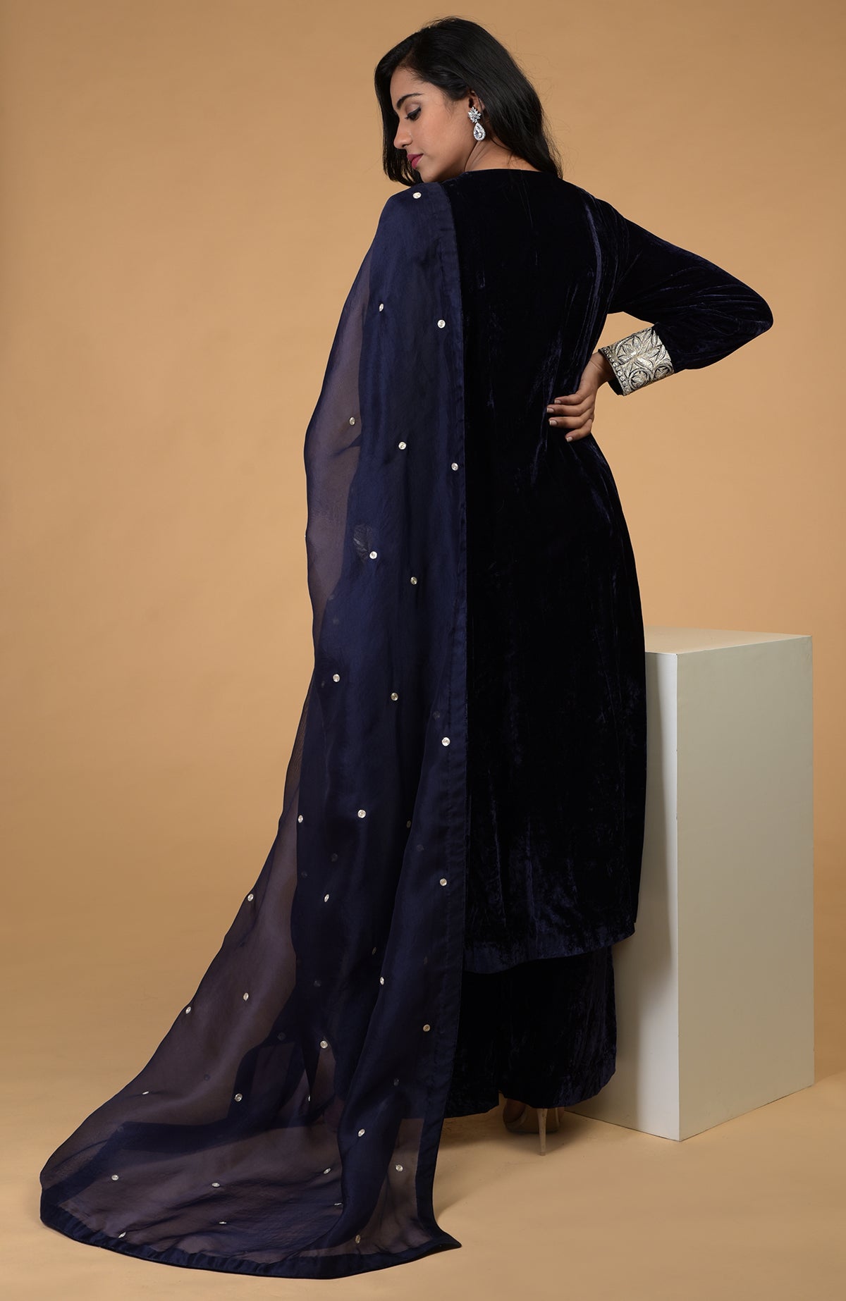Midnight blue velvet kurta set with silver Kashmiri tilla embroidery and organza dupatta.