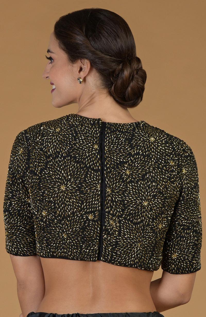 Black and gold hand-embroidered blouse with a back opening.