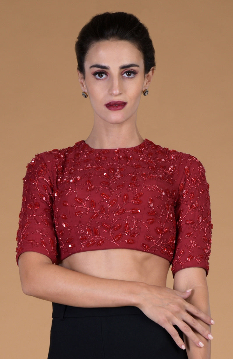 Red foliage hand embroidered blouse with elbow-length sleeves.