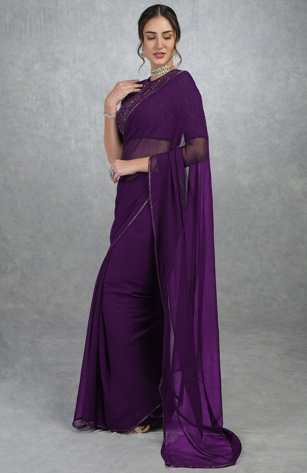 Plum purple gold hand embroidered saree and blouse.