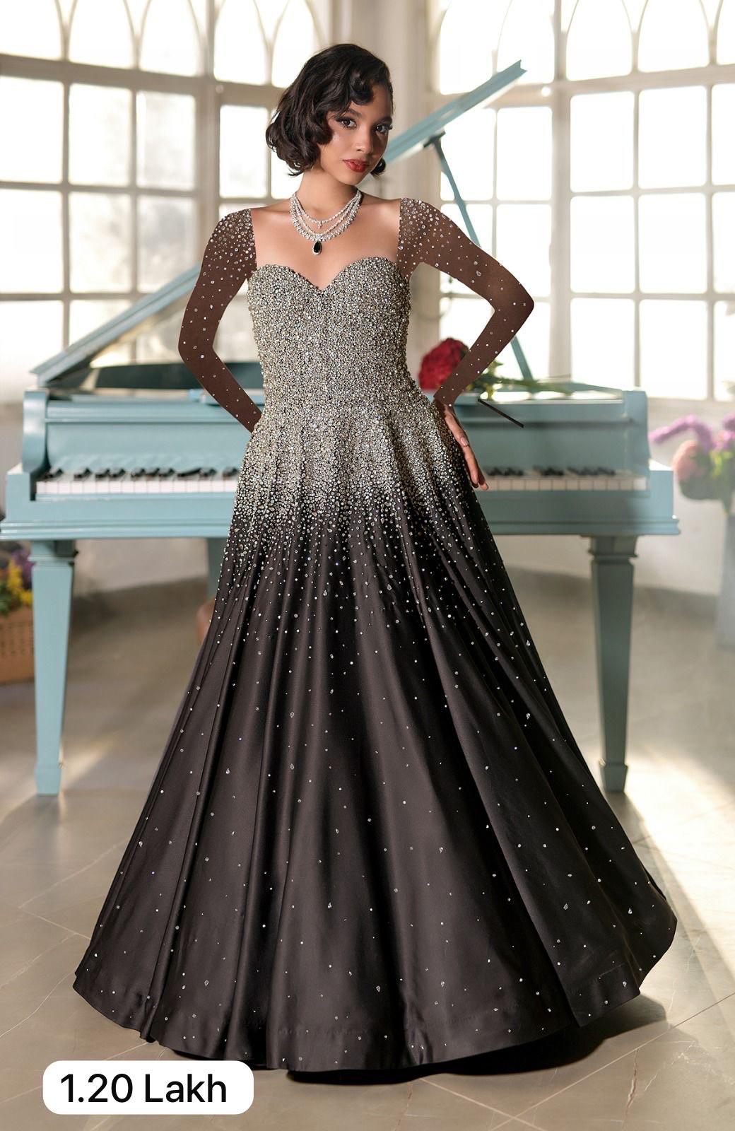 Black satin princess gown with crystal and pearl bead embroidery and sweetheart neckline corset.