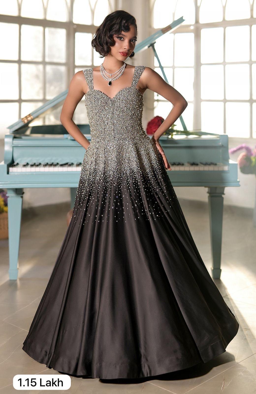 Black satin princess gown with crystal and pearl bead embroidery and a voluminous skirt