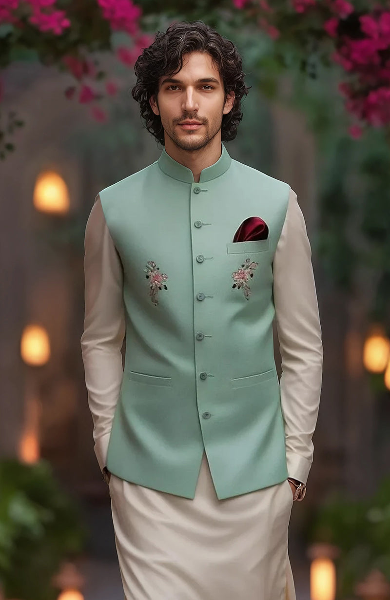 Beige full-sleeve kurta with tapered trousers and mint green floral embroidered bandi jacket